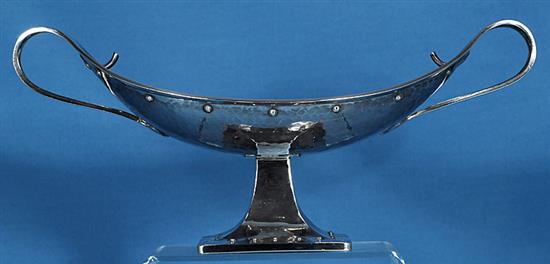 A George V Arts & Crafts silver navette shaped two handled dish, by Albert Edward Jones, Width 12 ¾”/320mm Weight: 18.3oz/520grms